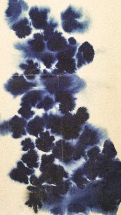 an abstract painting with blue and black ink on white paper in the shape of a tree