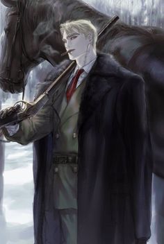 a man standing next to a horse with a long coat over it's shoulders