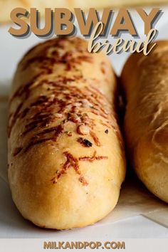 two breads sitting on top of a white plate with the words subway bread over it