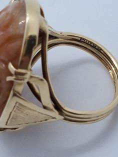 "You are viewing a beautiful 14k solid gold mings brown jade carved ring. The ring size approx. 5 1/4 can size up. The total weight of the ring is approx. 10.36 grams. The ring measures itself 29mm x 20mm wide. Marked 14k and mings inside. The ring has a beautiful brown jade carved with leaf and flower. Please take a closer look at the photos and video. Any question please send me a message. When listing and describing our items we make a conscious effort to over describe all imperfections and b Carved Yellow Gold Oval Rings, Carved Oval Yellow Gold Ring, Yellow Gold Carved Oval Ring, Formal Oval Carved Rings, Antique 14k Gold Carved Rings, Vintage 14k Gold Carved Ring, Vintage 14k Gold Ring With Carved Details, Formal Carved Rings In 14k Gold, Formal Carved 14k Gold Ring