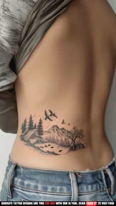 a woman's stomach with a mountain and trees tattoo on her side ribcage