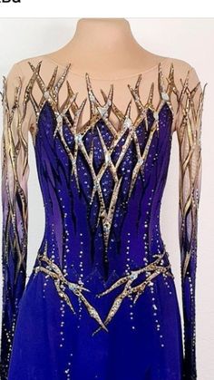 a blue dress with gold accents on it