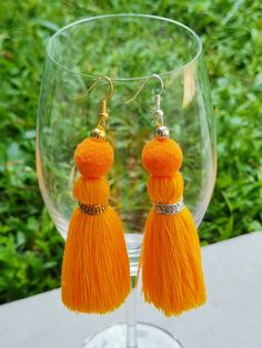 Tassel earrings in a variety of colors make a great gift! a perfect statement earring for those with sensitive ears! Weight: 0.08 ounce each Droplength: 4 Inches from the top of the earwire. These are handmade products. Made from threads and breads. lightweight. Colors may vary slightly due to screen settings. Yellow Bohemian Earrings With Latkans, Bohemian Yellow Earrings With Latkans, Bohemian Orange Fringe Earrings, Summer Tassel Dangle Earrings With Latkans, Yellow Tassel Earrings For Festival, Summer Tassel Dangle Earrings, Summer Latkans Tassel Dangle Earrings, Adjustable Yellow Bohemian Tassel Earrings, Yellow Bohemian Adjustable Tassel Earrings