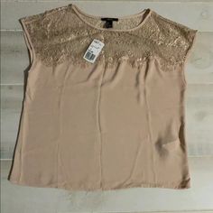 Nwt Forever 21 Capped Sleeve Lace Blush Top Blouse Lace Upper Body With Eyelash Scallop Trim. Capped Sleeves. Straight Hem. Pullover. Lace: 100% Nylon Body: 100% Polyester Size Small Measured Flat Pit To Pit/Chest 20” Shoulder To Hem 22.5” Elegant Spring Tops From Forever 21, Elegant Forever 21 Top For Spring, Feminine Short Sleeve Tops From Forever 21, Chic Beige Tops From Forever 21, Trendy Beige Forever 21 Top, Chic Beige Forever 21 Tops, Forever 21 Beige Summer Tops, Forever 21 Feminine Short Sleeve Tops, Beige Casual V-neck Lace Top