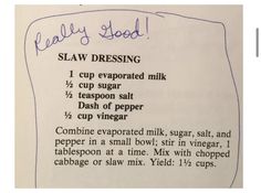 a recipe for slaw dressing is shown on a piece of paper with blue writing