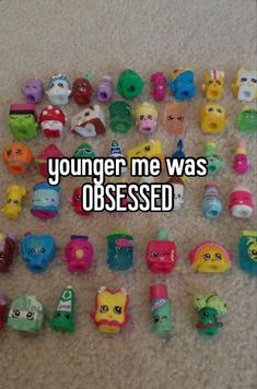 there are many toys on the floor with words that say, younger me was obesed