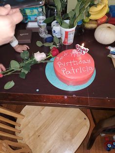 a birthday cake sitting on top of a wooden table