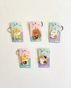 four small tags with different animals on them