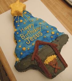 a birthday cake that is shaped to look like a rock with the words happy birthday jesus on it