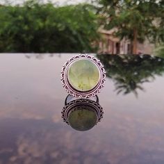 ---Prehnite Ring--- Prehnite brings comfort and peace to your heart chakra. It harmonizes the body by balancing out the masculine and feminine energies, which balances the intellectual, emotional, physical, and auric energies _._._._._._._._._._._._._._._._._._ Gemstone: Prehnite Gemstone Size: 15 mm Gemstone Shape: Round _._._._._._._._._._._._._._._._._._ Metal Type: Brass, 925 Sterling Silver Plated, Oxidized Weight :10-12 Gram (Approx) Made In: Jaipur, India _._._._._._._._._._._._._._._._._ Bohemian Green Opal Ring, Bohemian Green Crystal Round Ring, Green Bohemian Crystal Ring, Green Opal Ring Spiritual Style, Green Opal Spiritual Ring, Spiritual Green Opal Ring For Gift, Green Crystal Healing Ring, Spiritual Green Opal Ring Gift, Green Spiritual Crystal Ring For Healing