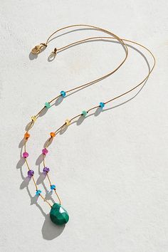 Embrace the light spectrum with Amalia's iconic rainbow drop necklace. Featuring a stunning, genuine chrysocolla pendant, each piece is delicately hand-knotted on nylon silk with natural rainbow gems. The signature rainbow sequence includes: Apatite, Amethyst, Ruby, Carnelian, Yellow Sapphire, and Emerald. **Features:** Beaded design, twisted nylon thread, precious rainbow stone beads, teardrop chrysocolla pendant, 14k gold-filled clasp closure, 17" length **Why We | Amalia Rainbow Drop Chrysoco Crystal Drop Necklace, Beaded Necklace Inspiration, Diy Gemstone Necklace, Handmade Necklace Designs, Mixed Beads Necklace, Light Spectrum, Bracelet Styles, Rainbow Stone, Silk Necklace