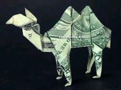 an origami camel made out of one hundred dollar bills is shown in this image