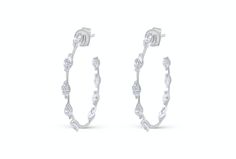 These sophisticated 18kt white gold hoop earrings are adorned with marquise-cut diamonds totaling 2.23 carats. The elongated shape of the marquise diamonds enhances the earrings' elegant allure, creating a dazzling, refined statement that effortlessly complements any ensemble. They make a wonderful gift for Christmas, birthdays, graduations, and more, ideal for Mom, a girlfriend, or a daughter. Daughter Graduation, White Gold Hoop Earrings, White Gold Hoops, Studded Necklace, Marquise Cut Diamond, A Daughter, Earrings Elegant, Christmas Mom, Marquise Diamond