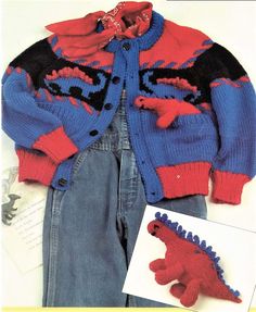 a knitted dinosaur jacket and jeans are on display