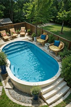 an above ground pool with steps leading up to the deck and seating area next to it