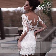 the back of a woman's dress with white lace on it and open shoulders