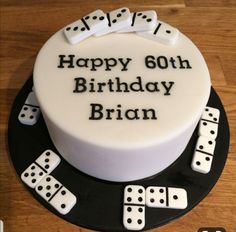 a birthday cake with dominos and dice on it