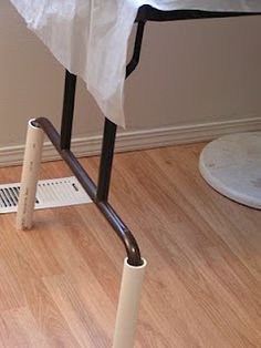 a toilet sitting on the floor next to a shower