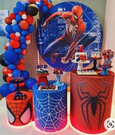 a spiderman birthday party with balloons and decorations