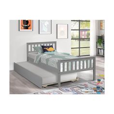 a child's bed with a pull out trundle