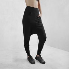 Edgy, cool streetwear style, black harem pants made from certified organic cotton with 10% lycra for comfort, fit and durability. These have a comfy set of side pockets, and a loose fit around the hips and extra volume at the ankle making these the perfect pair of pants for any body type or yoga, lounging, or night life. Totally versatile - create your look based on your need or situation. This cut flatters every body type with a relaxed, edgy, streetwear fit. Look fly AF but basically wearing y Baggy Wide Leg Harem Pants For Athleisure, Baggy Wide Leg Harem Pants Hip Hop Style, Baggy Wide Leg Hip Hop Harem Pants, Black Tapered Joggers With Hip Pockets, Black Baggy Techwear Bottoms, Black Harem Pants With Pockets For Streetwear, Black Full-length Hip Hop Pants, Hip Hop Style Baggy Harem Pants With Pockets, Harem Pants With Side Pockets For Streetwear