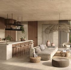 a living room filled with lots of furniture next to a kitchen and dining room table