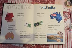 an open book with pictures of australia and other countries on it, sitting on a table