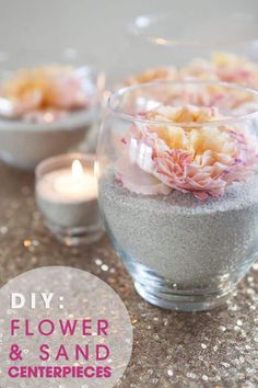 flowers and sand in small glass bowls with candles