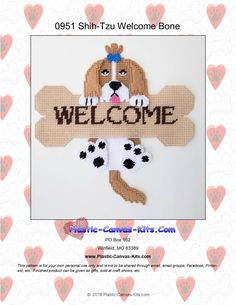 a cross stitch welcome sign with a dog on it's chest and paw prints