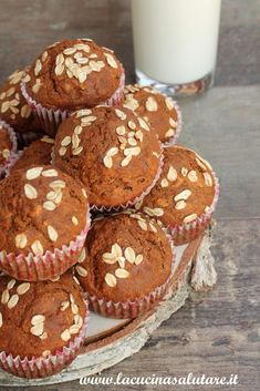 some muffins and a glass of milk on a table