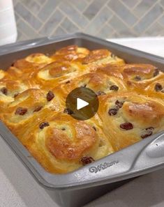 a pan filled with baked goods on top of a counter