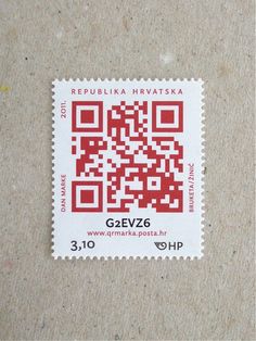 a red and white postage stamp with a qr code