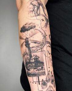 a man's arm with an image of a lighthouse and dog on the cover up