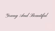 the words young and beautiful are written in black ink on a pink background with an image of