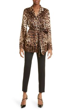 Dolce&Gabbana’s iconic leopard print makes a fierce statement on a fluid satin blouse sewn from stretch-hinted Italian silk. 29 1/2" length (size 40 IT) Notch collar Long sleeves 93% silk, 7% spandex Dry clean Made in Italy Women's Designer Clothing Fitted Leopard Print Blouse For Work, Luxury Patterned Silk Blouse, Luxury Silk Printed Blouse, Silk Long-sleeve Tops With Graphic Print, Dolce And Gabbana Leopard Print, Luxury Long Sleeve Leopard Print Outerwear, Blouse Nordstrom, Satin Blouse, Designer Outfits Woman