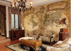 a living room with an old world map on the wall and antique furniture in it