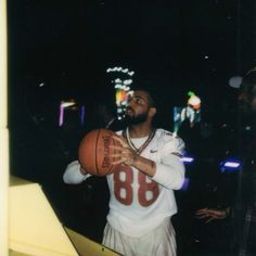 a man holding a basketball in his right hand