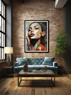 a living room filled with furniture and a painting hanging on the wall over a blue couch