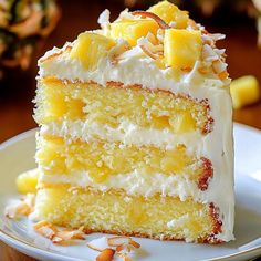 a slice of pineapple and coconut cake on a plate