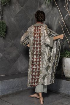 This unique, beautiful robe for women is made from a super soft rayon fabric. It is printed with a multicolor original Oriki print incorporating warm grey tones with patterns of blacks and reds. It is the ideal boho style kimono robe for women who want something different without sacrificing comfort. This robe has long sleeves, plain colored borders and falls at about mid-calf length. My designs feature my original graphics and illustrations. I love working with different color palettes and desi Bohemian Straight Kurta Set For Eid, Traditional Shawl Kaftan For Festivals, Bohemian Straight Kurta Sets For Transitional Season, Traditional Printed Maxi Kimono, Traditional Printed Maxi Length Kimono, Traditional Maxi Length Printed Kimono, Bohemian Maxi Kimono For Eid, Bohemian Maxi Length Kimono For Eid, Bohemian Printed Tunic For Eid