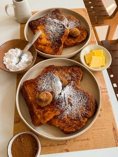 three plates with french toast and butter on them