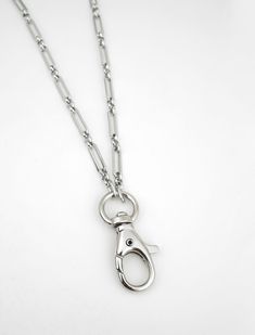 This silver lanyard necklace can serve as a badge holder for your ID card or as a ring holder necklace. It is made of stainless steel, and comes with a swivel lobster clasp. The necklace includes: - Stainless Steel lobster clasp on a swivel (33mm | 1 1/2 inches, including swivel) - Stainless Steel Paper Clip Chain (14 x 4mm links) ♥ ADD INITIAL CHARMS: http://etsy.me/2lf8zuM ♥ ADD BIRTHSTONE CHARMS: http://etsy.me/2zLPwLH Looking for more necklaces? Check out our collection: https://www.etsy.com/shop/charmphilosophygifts SHIPPING INFO We ship twice a week, usually Mondays and Thursdays. To USA: - Provider: Chit Chats Express (who deals directly with USPS) - Arrival Time: 5-10 days (1-3 days for preparation, 5-7 for shipping time) - Tracking: Yes - Ships out from Vancouver, Canada To Canada Silver Dog Tag Necklace With Lobster Clasp, Lanyard Badge Holder, Ring Holder Necklace, Lanyard Necklace, Chit Chat, Trombone, Birthstone Charms, Badge Holder, Initial Charm