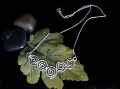 Celtic Spiral Necklace Artisan Handmade Spiral Necklace, Artistic Wire Wrapped Spiral Jewelry, Artistic Spiral Wire Wrapped Jewelry, Artisan Spiral Wire Wrapped Necklaces, Artisan Wire Wrapped Spiral Necklace, Artistic Handmade Spiral Jewelry, Artistic Handmade Swirl Jewelry, Artistic Spiral Nickel-free Jewelry, Spiral Symbol