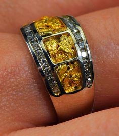 "Gold Nugget Ring \"Orocal\" RL1075DNW Genuine Hand Crafted Jewelry - One of a Kind - 14k Yellow Gold Casting - Approx. Total weight = 7.20G \" If this is not in Stock our Jeweler will make it in 4-6 weeks\" Specs and Dimensions: Length/Width Nugget Size - 7.5 Diamonds - .36ct - Total R stands for Ring L for Ladies, M Stands for Men and Q stands for the Quartz / E Stands for Earrings, and P stands for Pendants. Diamonds are G color High Quality Diamonds. With This Stunning Gold Nugget Ring you w