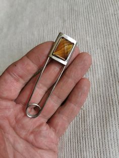 A large safety pin - a brooch, a pin. Made of new silver (German silver, melchior) and gemstone citrine. Handmade jewelry, gifts Jeweller's design, handmade brooch in German silver (melchior, new silver), copper and sapphire. A brooch can decorate, complement your scarf, dress or jacket. It can also be a great gift for a girl or woman who appreciates beautiful things. Pin size, length 8,5 cm. plot 1,8 cm. DELIVERY Processing time is 1-3 business days after ordering. I use Registered Delivery to send my items. You will receive the TRACKING number after the item is shipped. If you have any questions regarding this item, please do not hesitate to contact me. Handmade Safety Pin, Large Safety Pin, Safety Pin Brooch, Scarf Dress, Brooches Handmade, German Silver, Silver Brooch, Safety Pin, Citrine