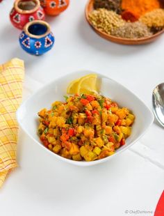 a white bowl filled with food on top of a table