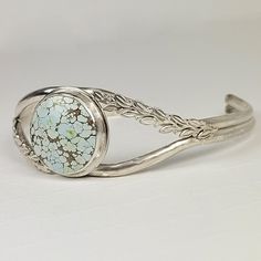 silver turquoise cuff bracelet with leaves Turquoise Cabochon Round Bracelets, Turquoise Round Cabochon Bracelets, Turquoise Cabochon Bracelet, Round Turquoise Sterling Silver Cuff Bracelet, 14kt Gold Jewelry, Turquoise Bracelet Cuff, Local Jewelry, Turquoise Cuff, Silver Jewelry Fashion