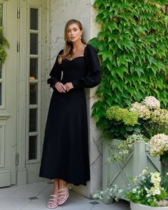 Fabric: Crepe Cotton 75%, Polyester 20%, Elastane 5% Puff sleeves Bustier bodice Midi Length Sleeve length: 70cm/ 27.5n Skirt length: 90cm/ 35.5in Evening Gala, Elegant Black Dress, Classic Black Dress, Romantic Design, Flowing Skirt, Crepe Fabric, Polished Look, Black Midi Dress, Fitted Bodice