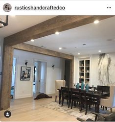 a dining room table and chairs in front of a fireplace