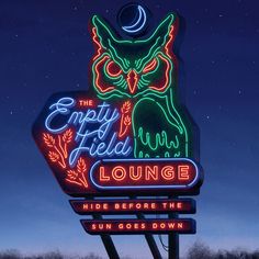 a neon sign that says the empty field lounge with an owl on it's head